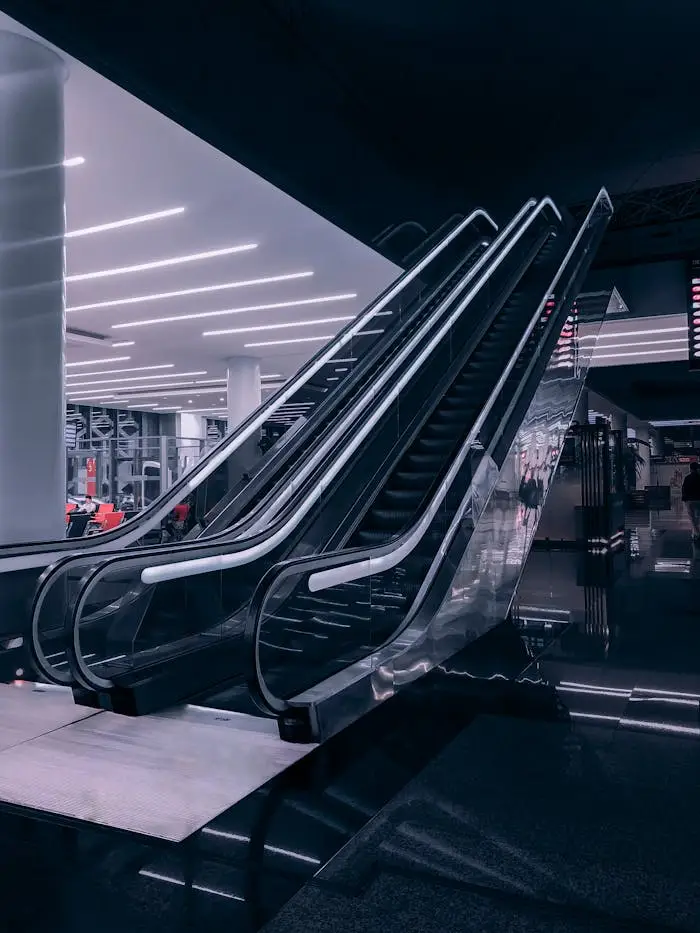 A sleek, modern escalator in an indoor shopping mall in Rabat, Morocco.